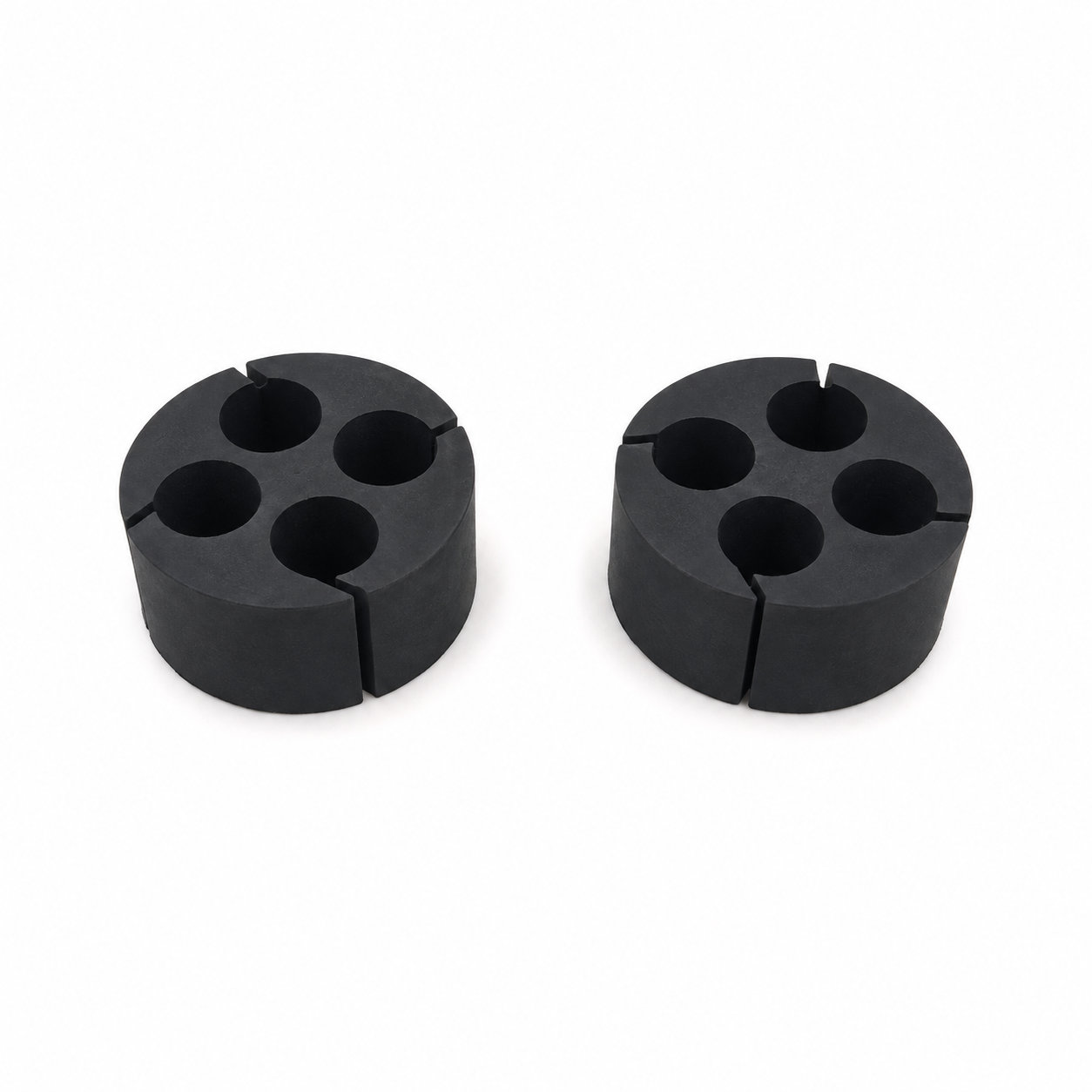 Molded flexible rubber grommet with four holes